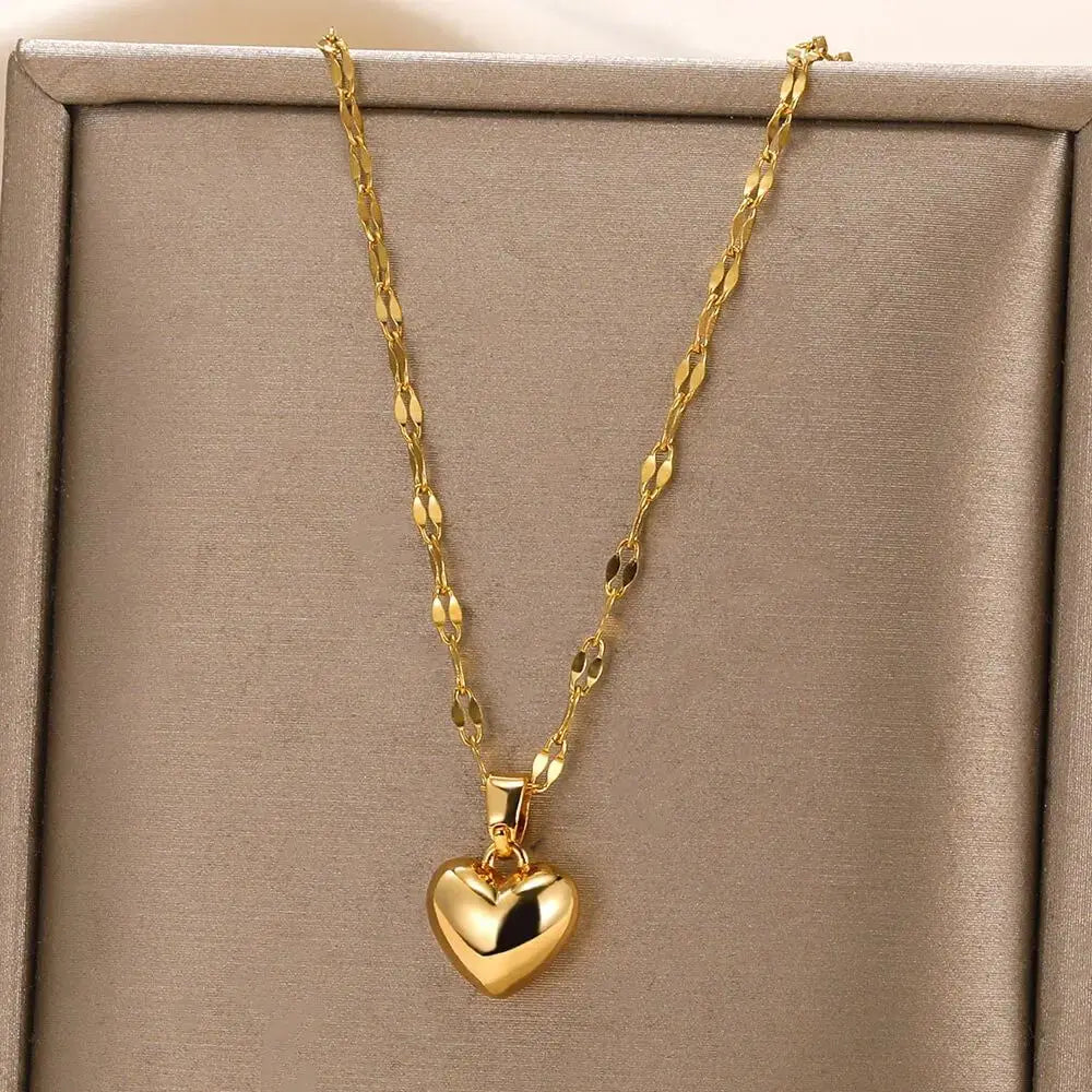 Gold Heart Pendant Necklace in front of box